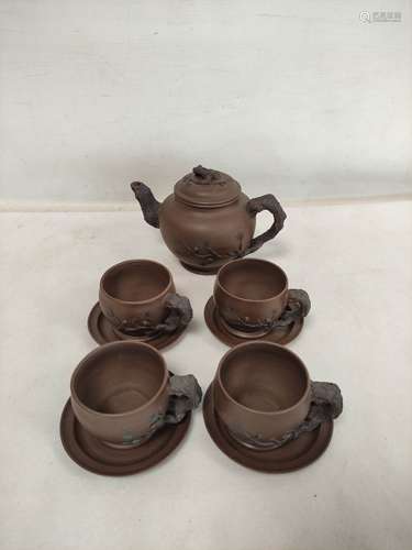 Chinese Yixing clay teapot with applied tree branch decorati...