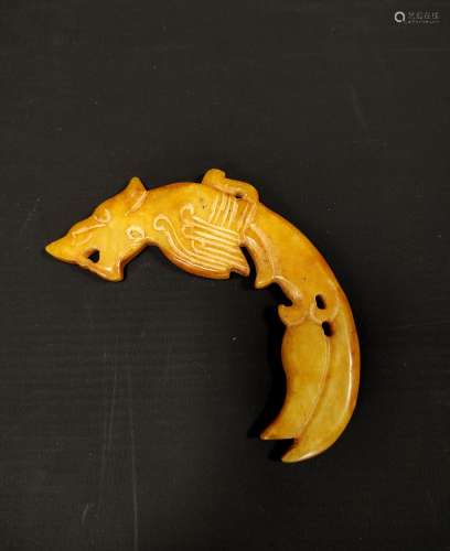 Red-brown Chinese jade carving of a curved mythical animal, ...
