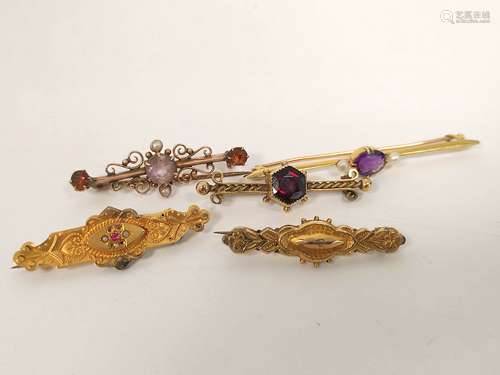 Garnet set bar brooch and four others.