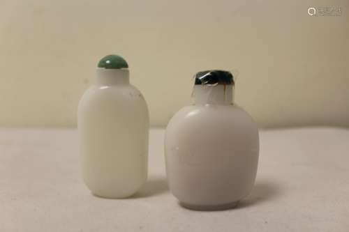 Two Chinese white glass snuff bottles to include one with a ...