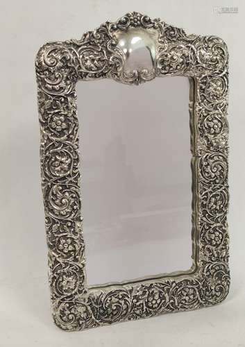 Easel mirror in electrotype silver embossed frame.