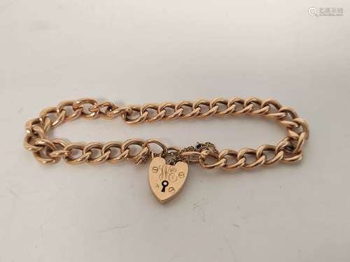 Gold hollow curb bracelet with padlock by Grinsells 9ct, 9g.