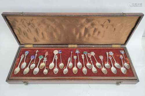 Collection of e.p. silver and other souvenir spoons in case.