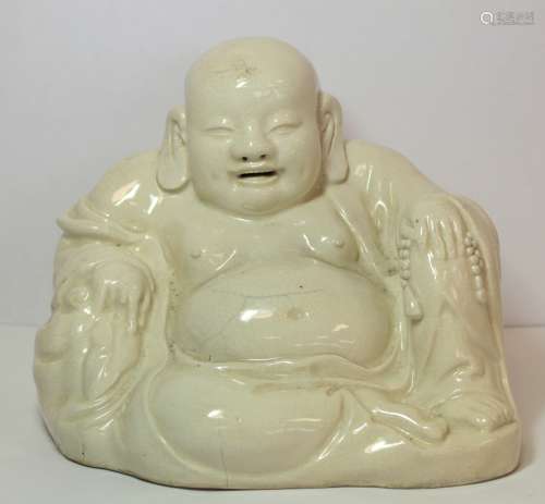 Oriental white glazed pottery figure of Buddha or Hotei, sea...