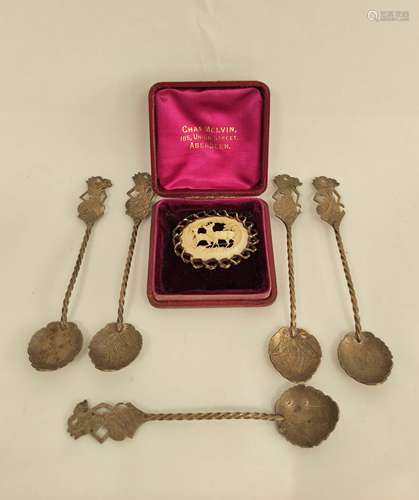 Five Indonesian silver coffee spoons and a delicately carved...