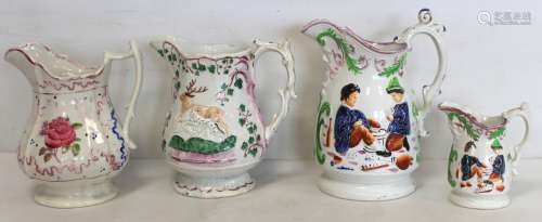 Victorian graduated pair of Staffordshire moulded jugs depic...