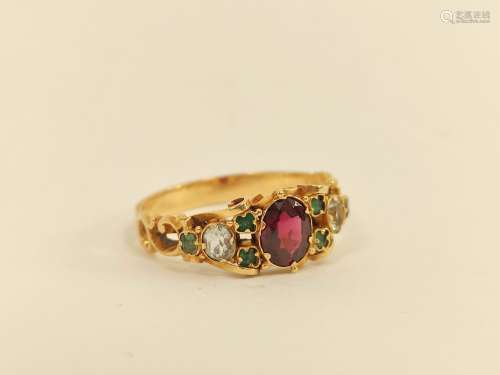 Victorian engraved gold ring with oval garnet, chrysolite an...