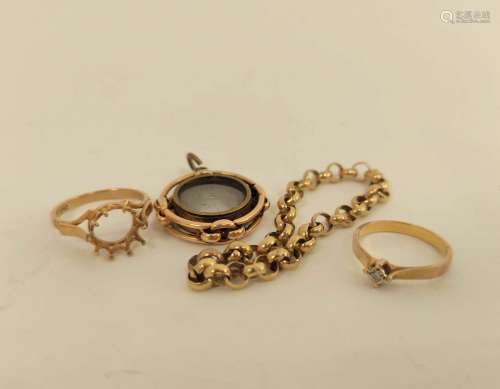 15ct gold compass charm, two rings and a piece of chain. 18g...