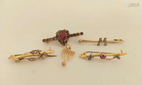 Four gold and other bar brooches and a charm.