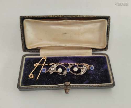 Edwardian gold brooch with scrolls of three sapphires and di...