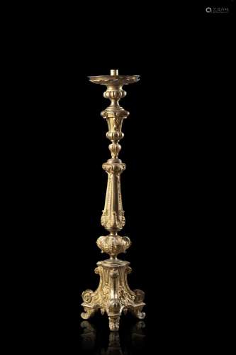 A 19th-century gilt-bronze tripod candelabra engraved with p...