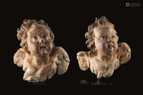 18th century art. Two polychrome terracotta cherubs with gla...