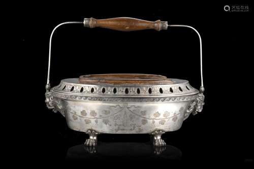 A silver warmer ciphered "FF" with wooden handle. ...