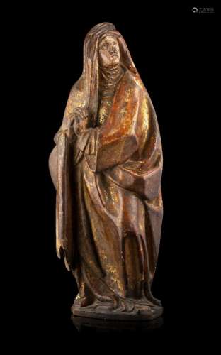 A 16th-century painted and partially gilded wooden sculpture...