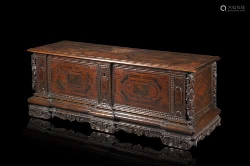 A Tuscan 17th-century various wood veneered settle decorated...