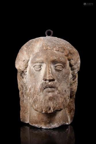 An antique stone sculpture depicting a male face (h. cm 25) ...