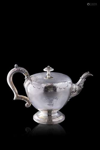 A silver teapot with an inscription reading "hoc age&qu...