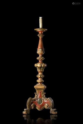 A 18th-century gilded, lacquered and carved wooden candle ho...