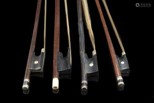 Lot comprising four bows Two German violin bows, one with a ...