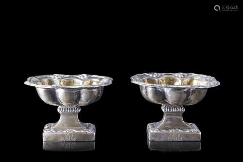 A 19th-century pair of silver saltcellars. Vermeil interior....