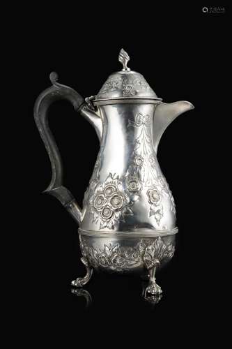 A silver coffe pot with an ebonized wooden handle. Birmingha...