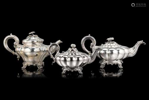 A lot comprising three silver teapots with bone mounts. Lond...