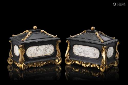 A 17th-century pair of Tuscan ebonized and carved wooden cas...