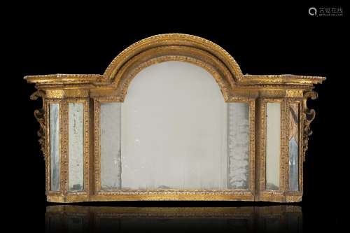 An 18th-century gilt wooden mantelpiece (cm 144x82) (losses)...