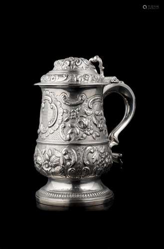 An embossed silver tankard. Inscription reading: "Trevo...