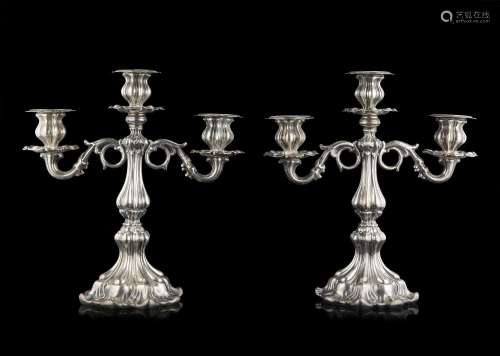 A pair of silver three-light candelabras. Titled 800 (h. cm ...