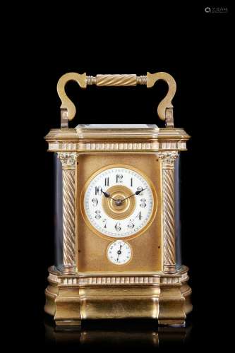 Brass and bevelled glass travel clock. Enamel dial with Roma...