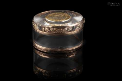 A rock crystal gilt-mounted snuff box. The lid is decorated ...