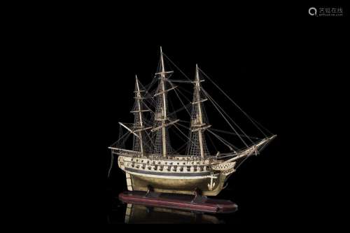 A 19th-century ivory carved, wooden and brass foil ship mode...