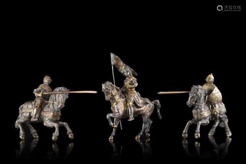 A 20th-century group of three partially gilt silver knight m...