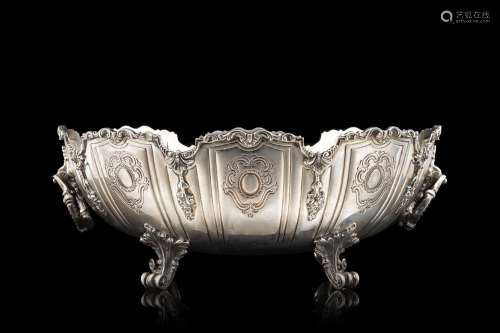 A Milanese silver chiselled double-handled centrepiece. Silv...