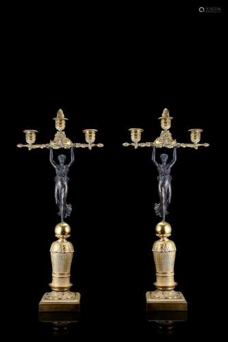 A 19th-century pair of bronze three-light candelabras (cm 23...