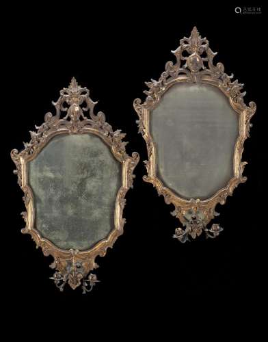 A pair of 18th-century carved and giltwood mirros with iron ...