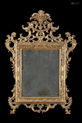 An 18th century carved giltwood mirror (cm 100x140) (defects...