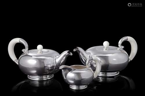 A silver tea and coffee set comprising a teapot, a coffee po...