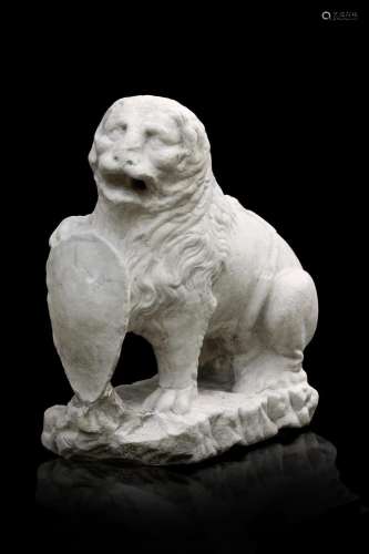 An antique marble sculpture representing a lion with a coat ...