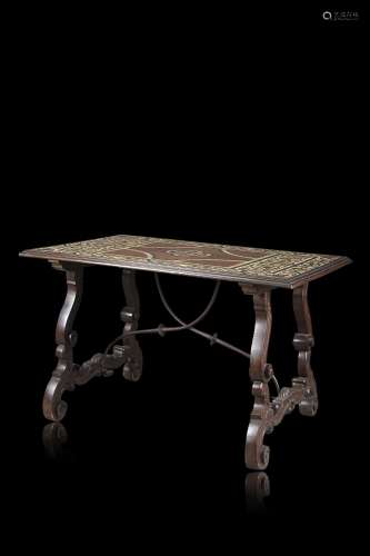 A mahogany and ebonized wood veneered centre table inlaid wi...