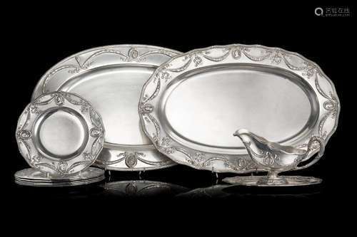 Part of an embossed silver table service in Louis XVI style,...