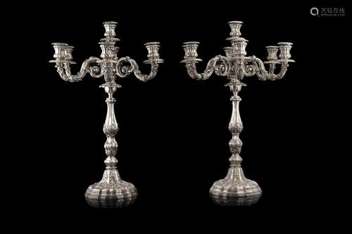 A pair of silver seven-light candelabras. Titled 800. Silver...