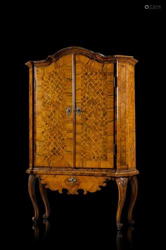 A 19th-century German burr walnut veneered and inlaid cupboa...