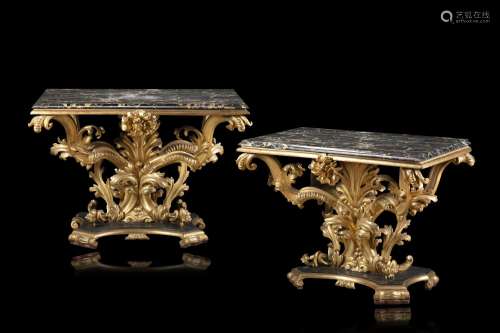 A pair of antique giltwood consoles carved with flowers and ...