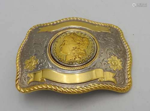 A DECORATIVE AMERICAN BELT BUCKLE SET WITH A DOLLAR COIN MED...