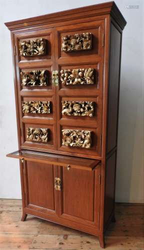 AN ANGLO-CHINESE ROSEWOOD DRINKS CABINET, with eight carved ...