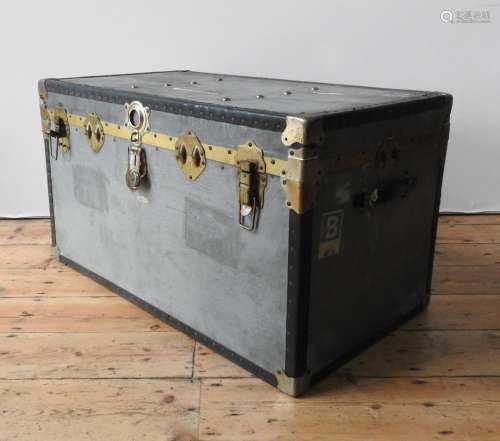 A TIN COVERED VINTAGE TRAVEL TRUNK, with two handles, latche...