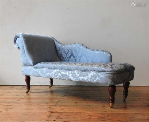A CHILD'S DAMASK UPHOLSTERED CHAISE LONGUE, covered in teal ...