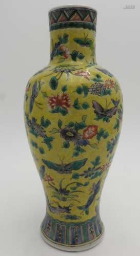 A 19TH CENTURY FAMILLE ROSE YELLOW GLAZED BALUSTER VASE, 25 ...